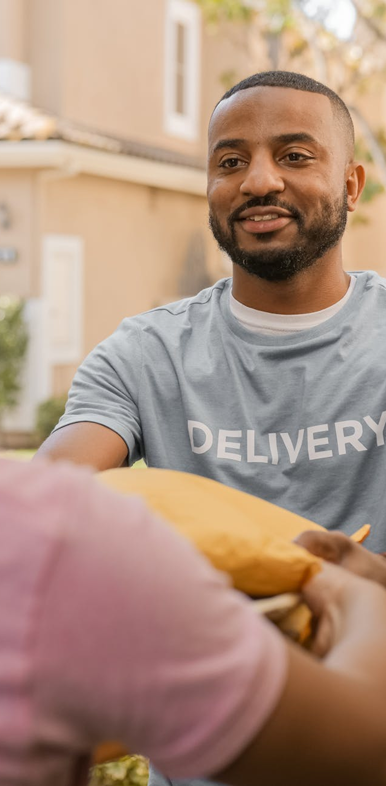 Delivery person handing package